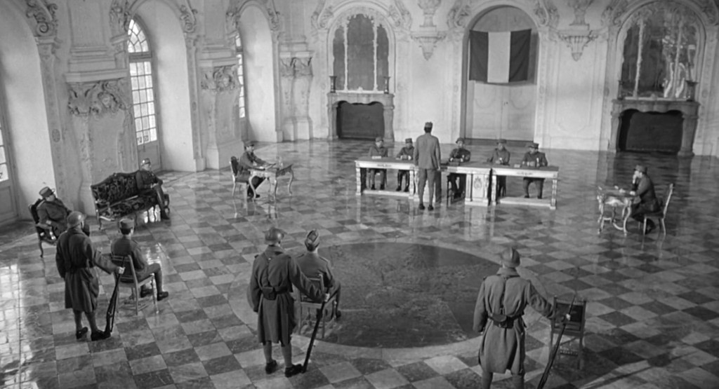 Kubrick uses space to confine his characters. In tight and cramped trenches, there's nowhere to run, but vast and empty space creates confinement as well.